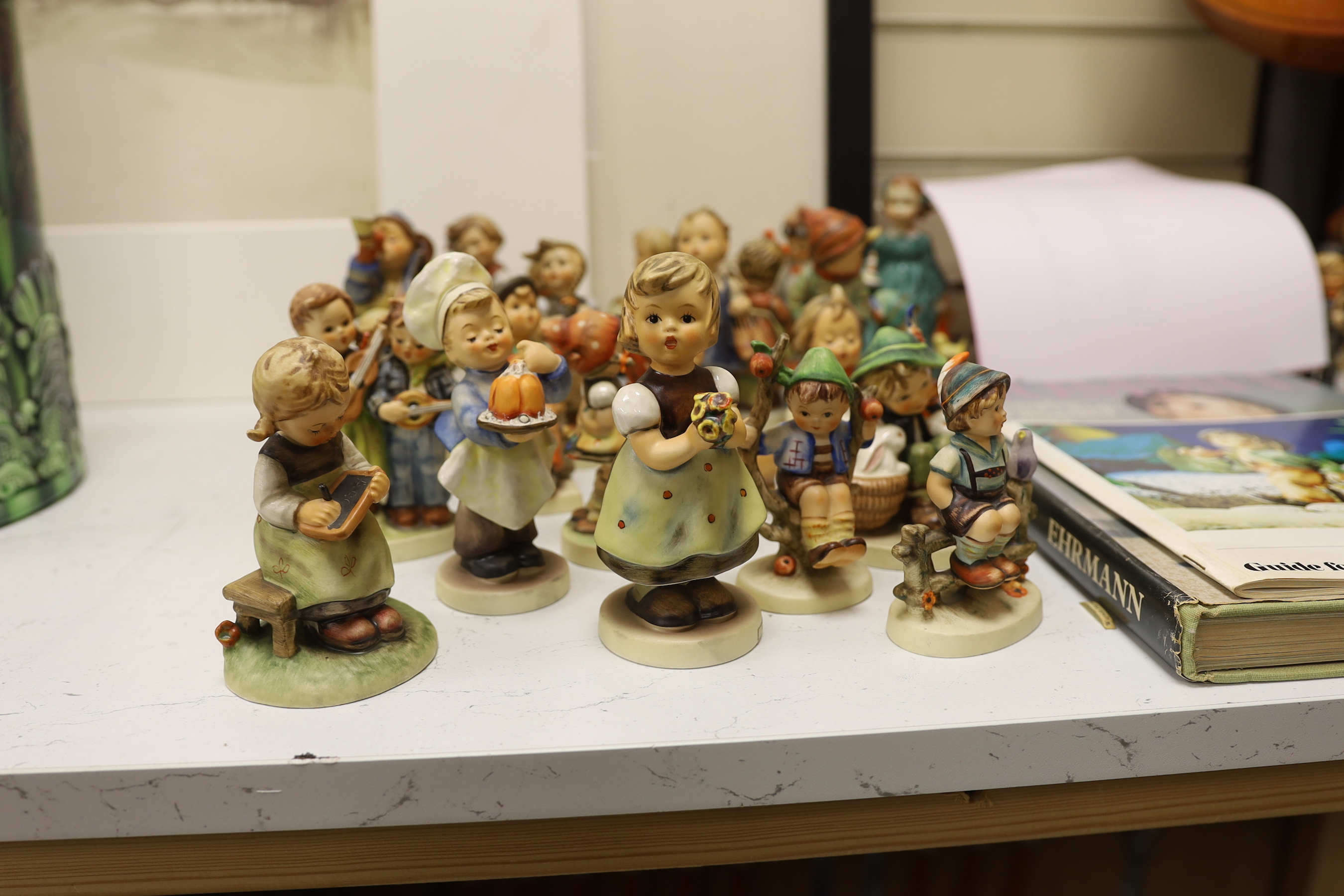 A collection of Hummel / Goebel figures